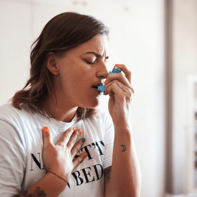 10 Warning Signs of Mold Toxicity- woman with inhaler and breathing problems